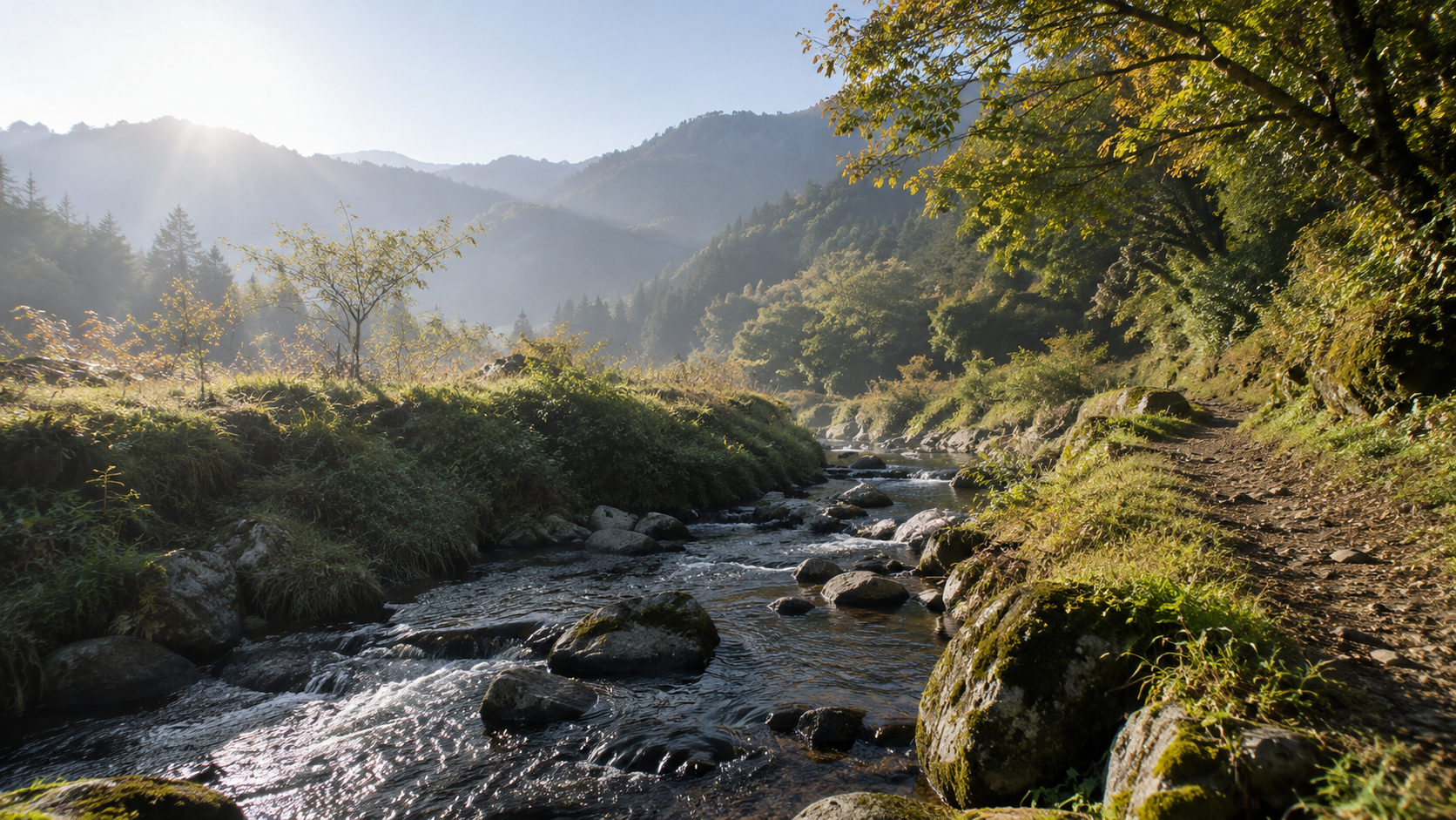 岩と緑の岸に沿って流れる小川の創作情景